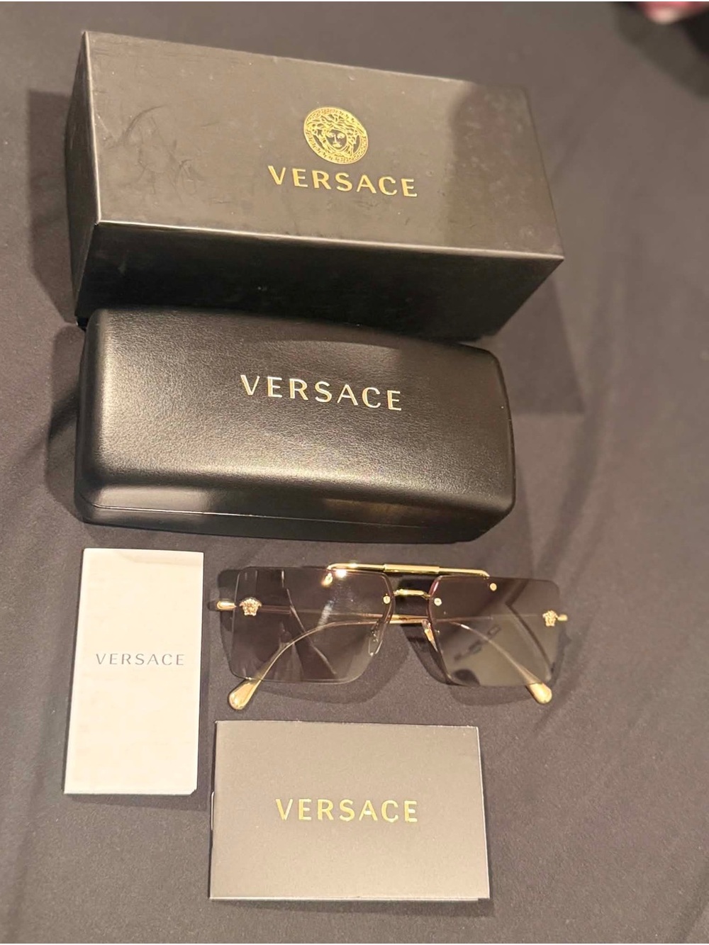 Versace Men’s Gold Rimless Sunglasses with Black Gradient Lenses